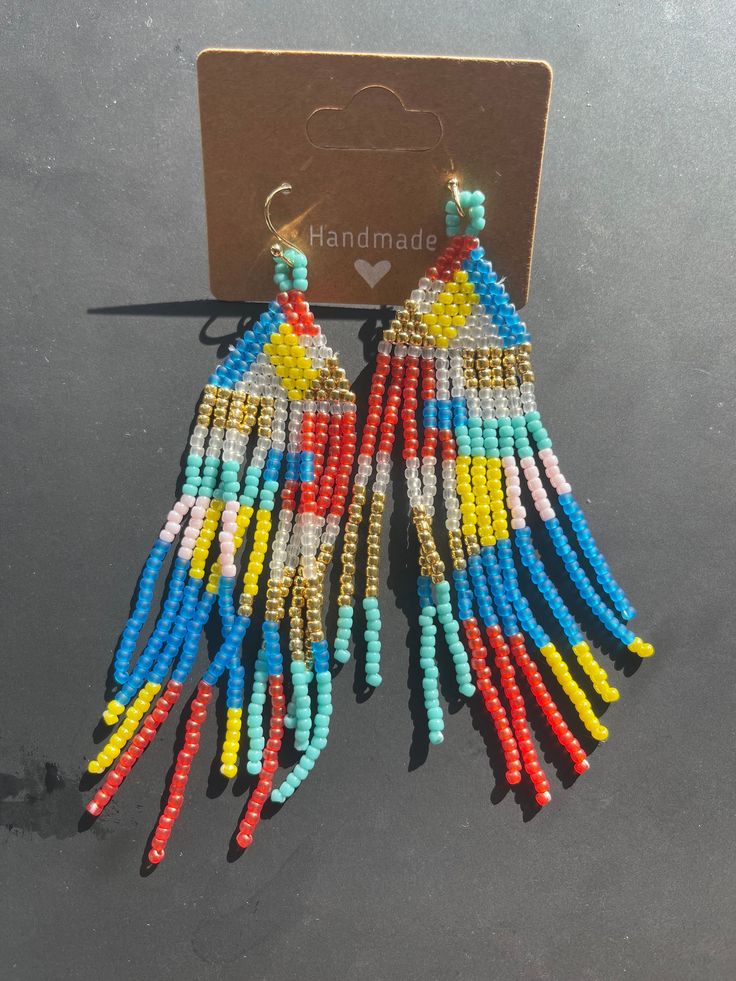 These handmade earrings are beaded with ToHo seed beads  . Beaded Tassel Earrings For Beach, Handmade Heishi Beads Earrings For Festivals, Summer Beaded Chain Dangle Earrings, Handmade Multicolor Heishi Beads Earrings, Multicolor Beaded Chain Earrings For Summer, Summer Multicolor Beaded Chain Earrings, Beaded Tassel Drop Earrings, Colorful Dangle Beaded Earrings, Colorful Adjustable Heishi Beaded Earrings