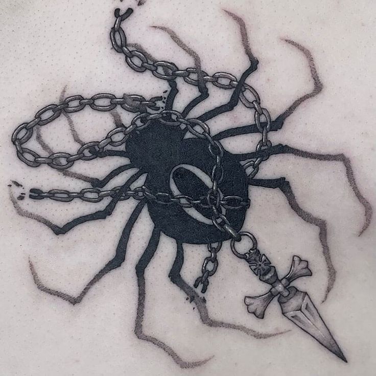 a drawing of a spider with chains and a knife on it's back side