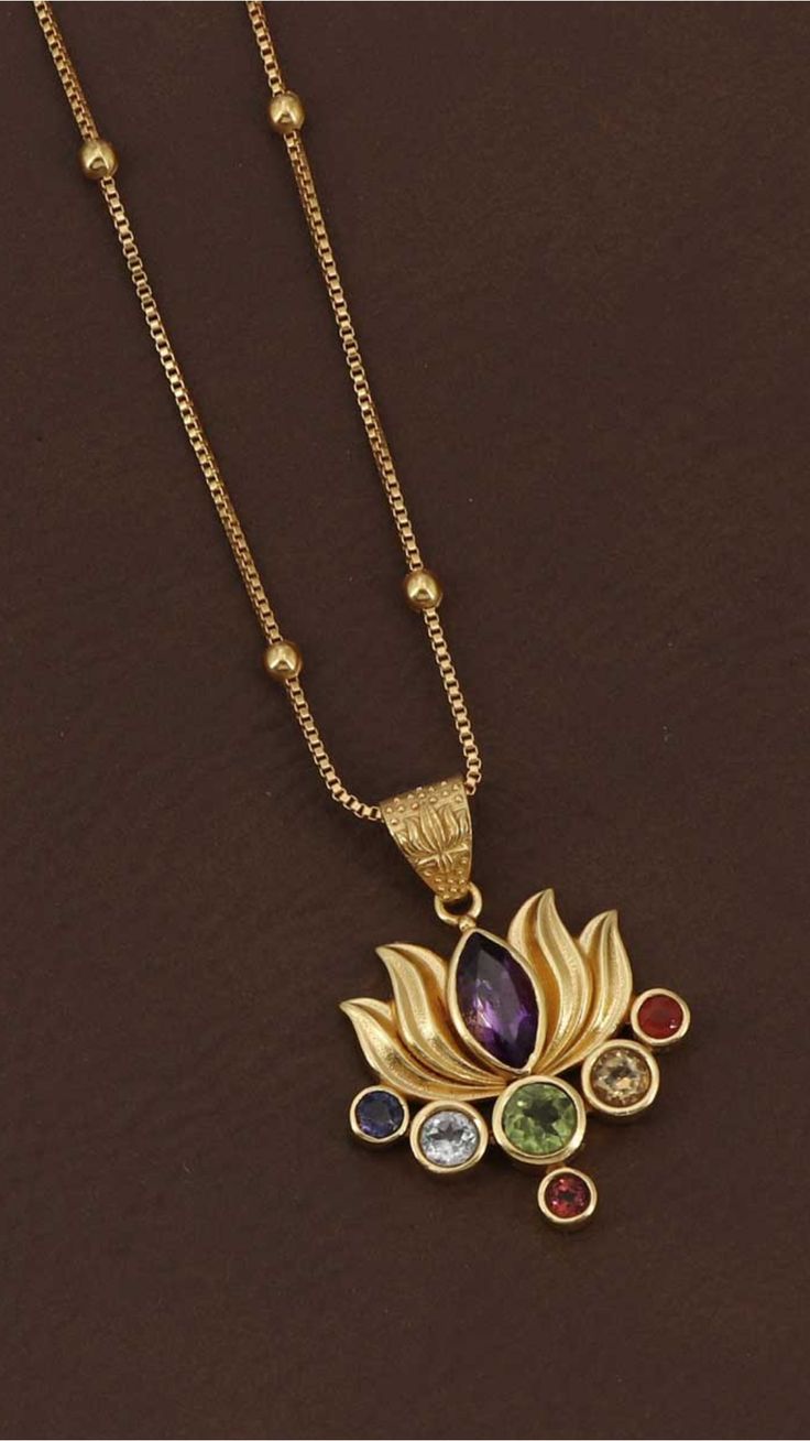 Gold chain necklace with a lotus pendant featuring colorful gemstones on a dark background. Buddhist Lotus, Spiritual Balance, Gem Pendant, Seven Chakra, Lotus Earrings, Lotus Jewelry, Lotus Pendant, The Lotus Flower, Seven Chakras