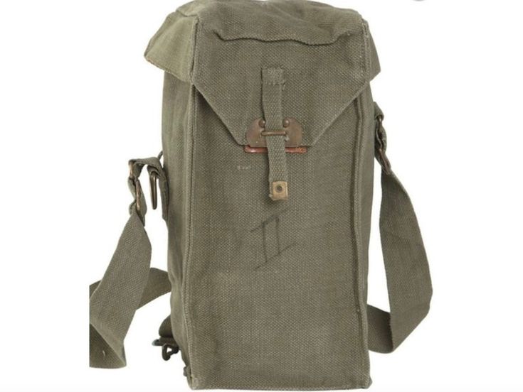 the back side of a canvas bag with straps and buckles on it, showing the front pocket