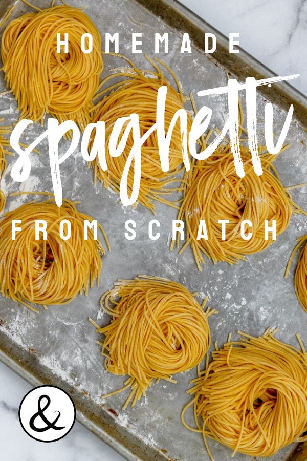 spaghetti on a baking sheet with the words homemade spaghetti from scratch