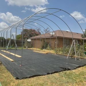 an outdoor play area in the middle of a yard