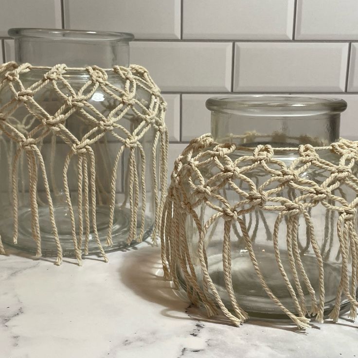 two glass jars with rope wrapped around them