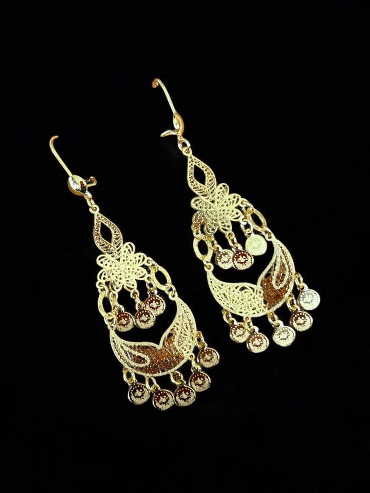 These elegant Telfit Drop gold earrings are light weight yet make a statement at three inches long. The perfect addition to any outfit for a touch of sophistication and style. Crafted with expert precision, these earrings are sure to elevate your look. Elegant Rose Gold Filigree Earrings, Elegant Metal Linear Earrings For Evening, Elegant Nickel-free Clip-on Earrings For Evening, Gold Metal Drop Bridal Earrings, Elegant Brass Filigree Hoop Earrings, Gold-tone Metal Earrings For Evening, Nickel-free Yellow Gold Chandelier Earrings, Nickel Free Yellow Gold Chandelier Earrings, Nickel-free Yellow Gold Metal Chandelier Earrings