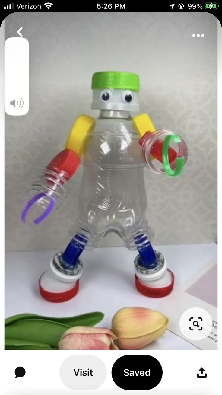 an image of a bottle with a toy in the shape of a robot