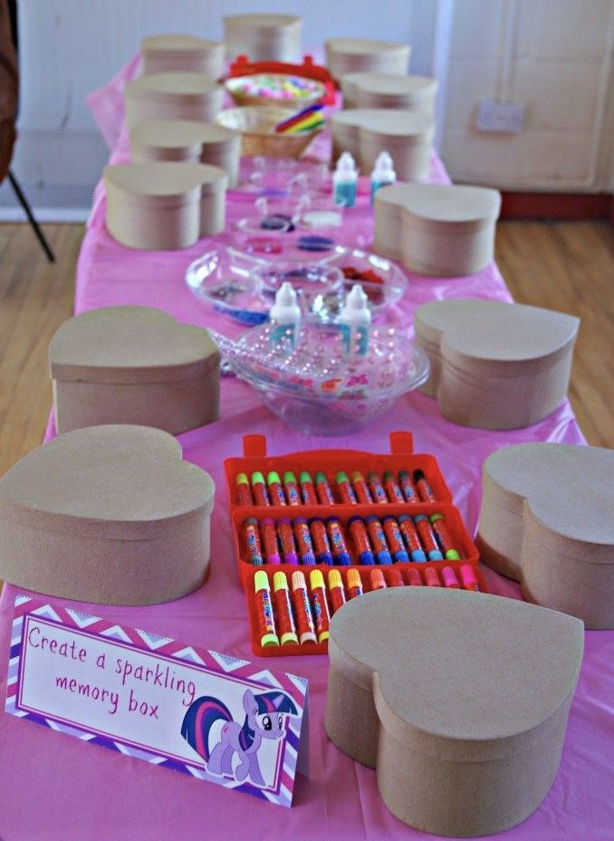 the table is set up with many items for children's birthdays and parties