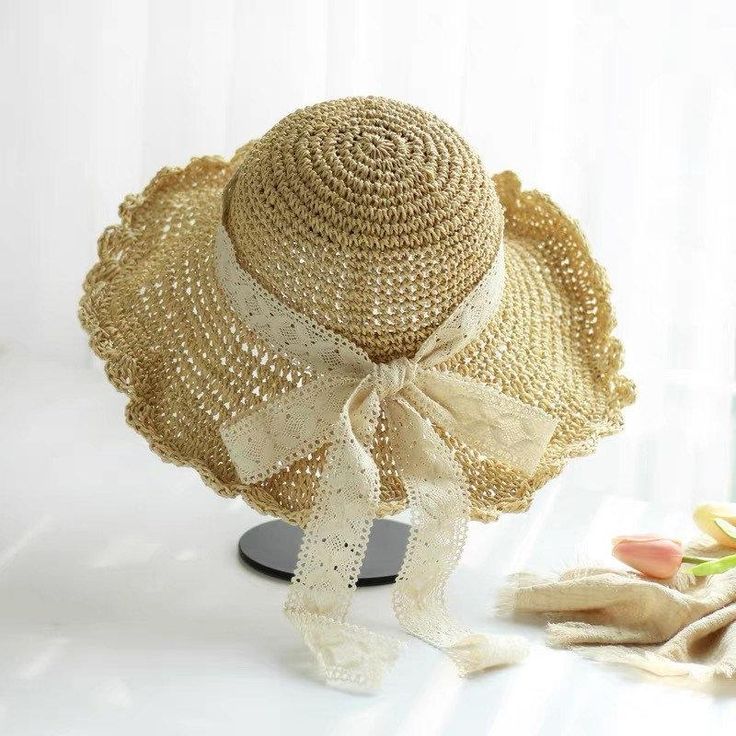 Stay cool and stylish with our natural straw hat, designed with a wide brim and scalloped edge for excellent sun protection. The lightweight and breathable material, combined with an open weave pattern, ensures maximum airflow to keep you comfortable. A delicate lace ribbon bow adds an elegant touch, while the adjustable inner band offers a secure and perfect fit. Ideal for beach outings, garden parties, and picnics, this hat provides both functionality and a feminine look for any summer occasio Bohemian Hat With Crochet Trim, Beach Hat With Adjustable Crochet Lace, Beach Hat With Crochet Lace And Adjustable Fit, Spring Straw Sun Hat With Open Weave, Summer Hat With Crochet Lace, Spring Sun Hat With Crochet Trim And Curved Brim, Summer Hats With Crochet Trim, Spring Crochet Lace Hat, Summer Beach Hat With Crochet Lace