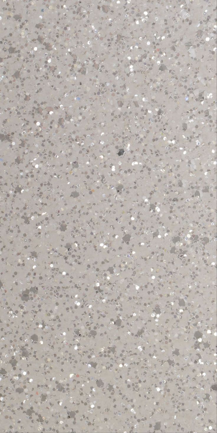 an image of a white and gray surface with small dots on it's surface