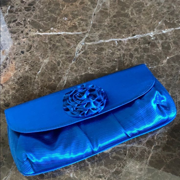 Brand New Evening Bag/Clutch In Blue With Flower On Top. Short Silver Chain To Use As Bag Elegant Blue Shoulder Bag Clutch, Blue Formal Bag With Removable Pouch, Elegant Blue Clutch For Everyday Use, Blue Formal Shoulder Bag, Formal Blue Shoulder Bag, Blue Pouch Clutch For Formal Occasion, Blue Rectangular Shoulder Bag For Events, Blue Clutch Bag For Formal Occasions, Elegant Blue Pouch Bag