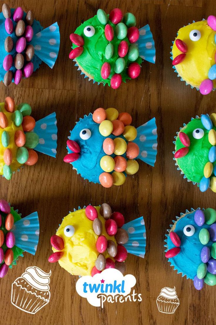 cupcakes decorated to look like fish on a table