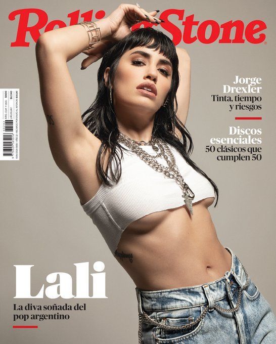 an image of a woman in jeans on the cover of rolling stone magazine, with her arms behind her head