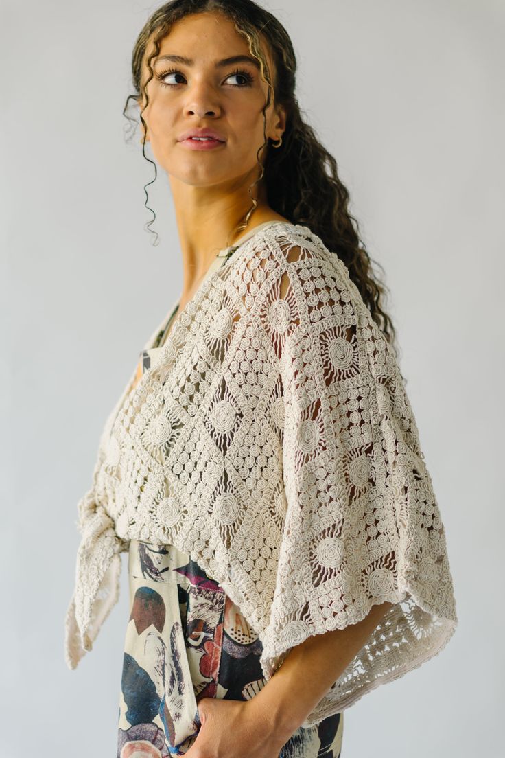 Introducing the Arata Crochet Cardigan, your new favorite piece for those breezy spring days. Made with a natural color and a playful crochet pattern, this cardigan is perfect for layering and adding a unique touch to any outfit. Stay stylish and comfortable with the Arata Cardigan! Details self: 100% cotton lining: 100% rayon Fabric Care Guide Here Sizing & Fit Measurements are approximate and taken while laying flat across the front. Not doubled. small: bust =36"; length = 12" medium: bust = 4 Handmade Crochet Top For Beach Cover-up In Spring, Handmade Crochet Top For Spring Beach Cover-up, Spring Festival Crochet Lace Cover-up, Cream Open Knit Summer Cardigan, Summer Open Knit Cream Cardigan, Open Knit Summer Shrug For Beach, Spring Bohemian Crochet Top With Crochet Trim, Open Knit Shrug For Summer Beach, Bohemian Crochet Top With Crochet Trim For Spring