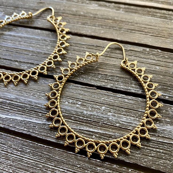 Step into the world of timeless elegance with our Handcrafted Mandala Hoop Brass Earrings - a mesmerizing blend of artistic flair and bohemian charm. Meticulously crafted in brass, these earrings feature intricate mandala designs that add a touch of spirituality and style to your ensemble. Material: High Quality Brass  Width - 2 1/4 inches (5.71cm) Length - 2.5 inches (6.35cm) LIGHTWEIGHT  🌟 **Key Features - **Artisanal Craftsmanship Each pair is meticulously handcrafted, ensuring a unique and individual touch. - **Bohemian Mandala Design Delicate hoops adorned with intricately designed mandalas, creating a harmonious balance of artistry and style. - **Versatile Statement These earrings effortlessly complement both casual and formal outfits, making them a versatile addition to your jewelr Metal Hoop Jewelry With Intricate Design, Intricate Hoop Metal Jewelry, Summer Festival Spiritual Jewelry, Spiritual Summer Festival Jewelry, Intricate Brass Hoop Earrings, Bohemian Chandelier Earrings With Ear Wire For Festivals, Bohemian Nickel-free Earrings For Festivals, Bohemian Teardrop Hoop Earrings With Ear Wire, Bohemian Metal Chandelier Earrings With Ear Wire