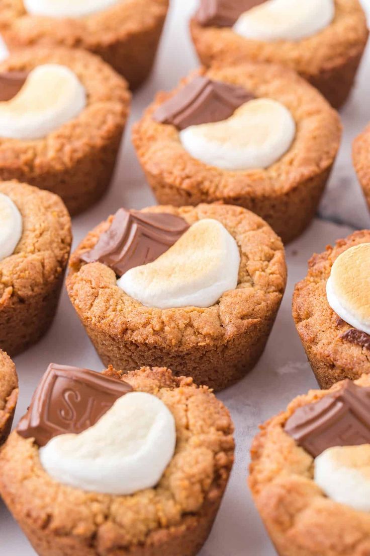 several cookies with marshmallows and chocolate on top