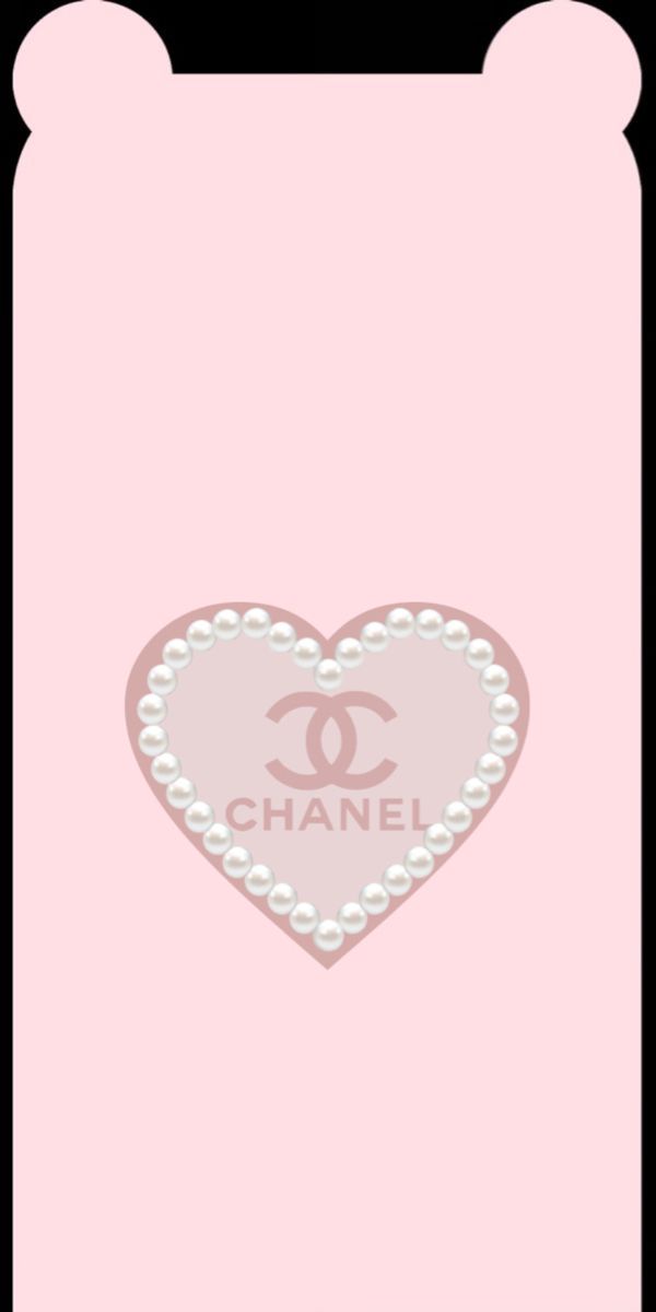 a pink chanel heart with pearls on the bottom and an inscription that says chanel