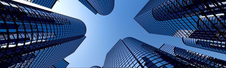 looking up at tall buildings in the city