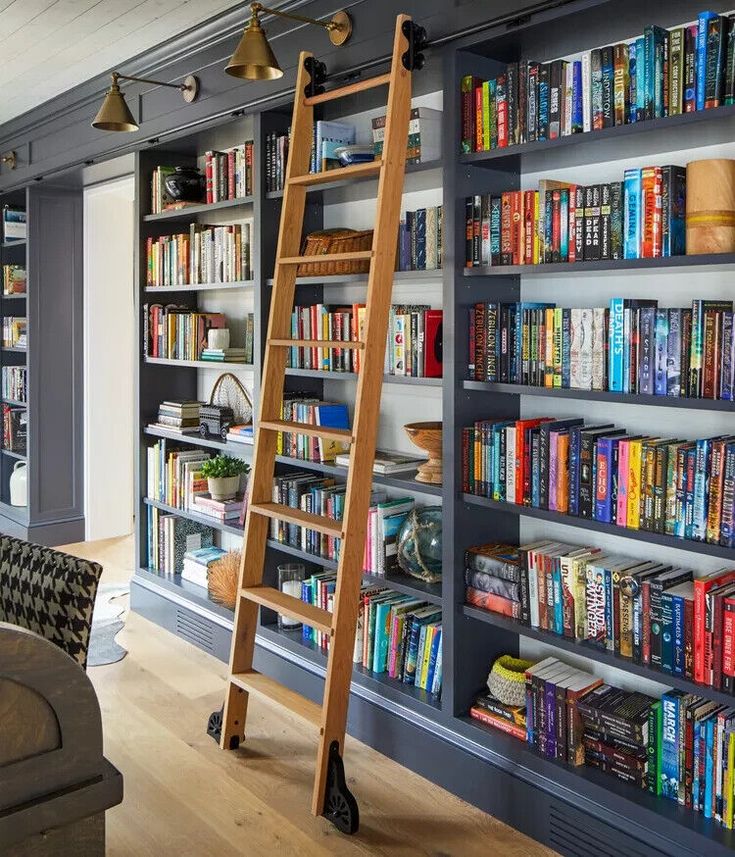 a ladder leaning up against a bookshelf filled with books