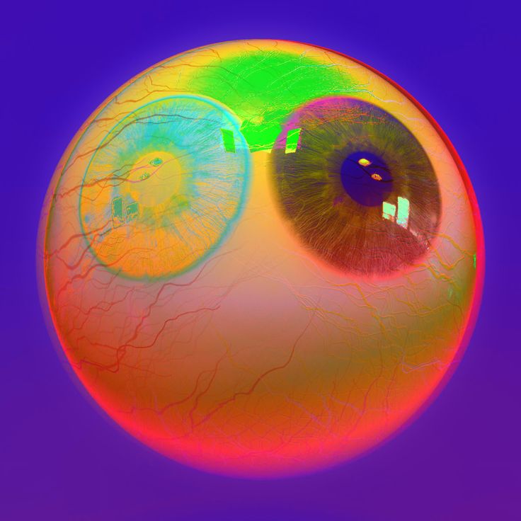 an eyeball with two different colored circles on it's side and one in the middle