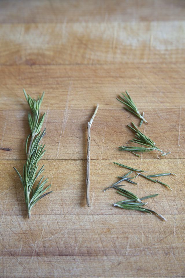 rosemary sprigs on a cutting board ready to be used as garnishes