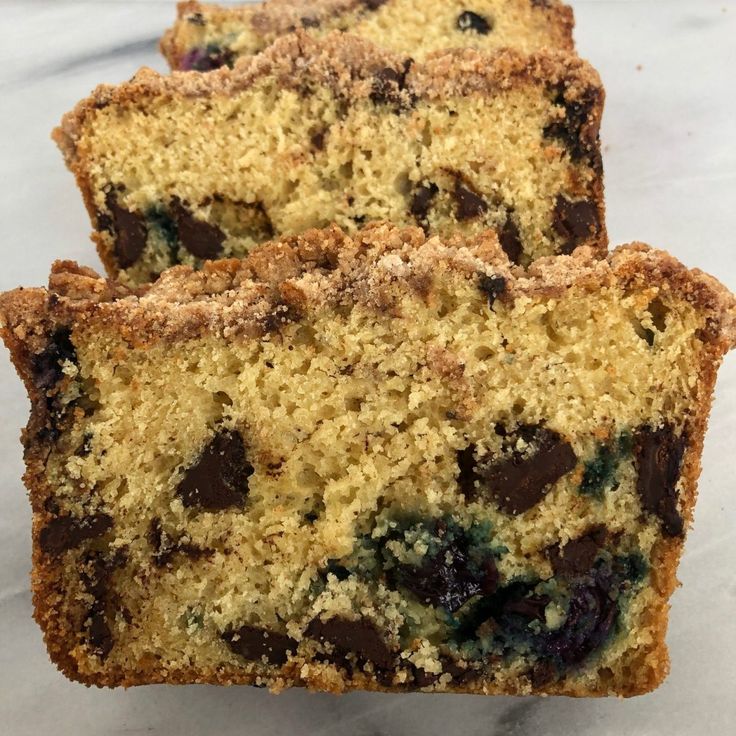 two pieces of cake sitting on top of a counter next to each other with crumbs all over them