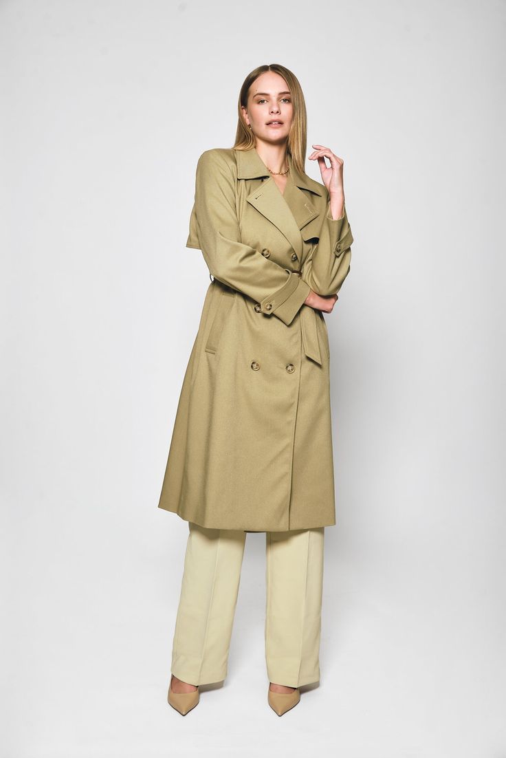 Step out in style with the Audrey Trench Coat by Lakeyo – the ultimate in sleek, sophisticated fashion.Crafted from a premium blend of 97% polyester and 3% spandex, this trench coat offers both style and comfort. The lightweight material makes it perfect for layering, while the tailored fit flatters your figure with a belted waist to accentuate your curves.Featuring a classic double-breasted front closure and a notched collar, the Audrey Trench Coat has a timeless, versatile look that never goes out of style. The premium material is both lightweight and durable, making it the perfect choice for any occasion.The Audrey Trench Coat by Lakeyo is available in a range of sizes, ensuring a perfect fit for any body type. Whether you're dressing up for a special event or simply running errands aro Spring Gabardine Pea Coat With Double-breasted Button, Spring Gabardine Pea Coat With Double-breasted Button Fastening, Spring Gabardine Long Pea Coat, Spring Workwear Pea Coat With Belted Cuffs, Spring Business Outerwear With Belted Cuffs, Spring Long Gabardine Pea Coat, Long Gabardine Pea Coat For Spring, Spring Single-breasted Gabardine Pea Coat, Spring Pea Coat With Belted Cuffs For Work