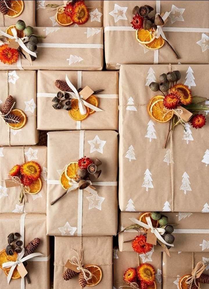 wrapped presents with oranges, pine cones and nuts are arranged on top of each other