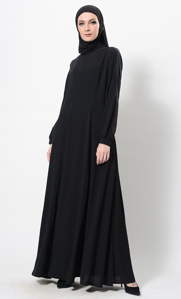 Sober Sublime Abaya Dress And Hijab Set - EastEssence.com Modest Maxi Dress With Modesty Panel, Flowy Maxi-length Abaya For Eid, Long Sleeve Modest Abaya With Modesty Panel, Modest Long Sleeve Abaya With Modesty Panel, Modest Flowy Maxi Dress, Modest Maxi Length Thobe With Modesty Panel, Modest Long Sleeve Thobe With Modesty Panel, Elegant Solid Color Abaya With Modesty Panel, Modest Floor-length Abaya