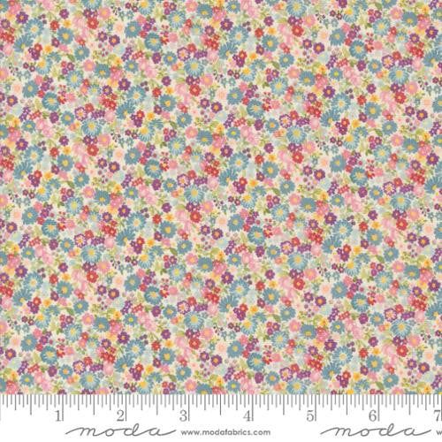 an image of a flowery fabric with small flowers in pastel colors and pinks