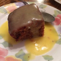 a piece of cake on a plate with a spoon