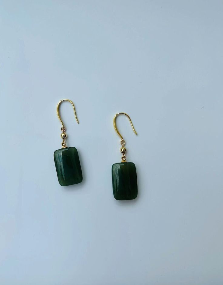 A pair of elegant rectangle-shaped dark green jade cube earrings with 14k gold ear wire. They are made from high-quality real Chinese jade and 925 sterling silver plated with 14k gold. Simple and minimalistic design works great for all sorts of occasions: dating, daily wear, home or office, you name it. Perfect as a gift for your loved ones or yourself. Highlights: ♥ High-quality materials Hand-made with quality dark green jade, paired with 925 sterling silver plated with 14k gold. Ensure long last wear and they are friendly for sensitive skin. ♥ Simple and minimalistic design Great for all sorts of occasions and perfect for gifting  ♥ Measurements Each drop is measured 1.5cm diameter and 2.5cm long. ♥ 100% Satisfaction Guarantee Gift-worthy packaging included! Please include a message if Cheap Green Minimalist Jewelry, Cheap Green Danglers Perfect As Gifts, Affordable Handmade Jade Earrings, Handmade Jade Earrings, Cheap Bohemian Green Earrings, Affordable Jade Bead Earrings, Cheap Everyday Green Earrings, Green Rectangular Earrings For Formal Occasions, Elegant Green Rectangular Earrings