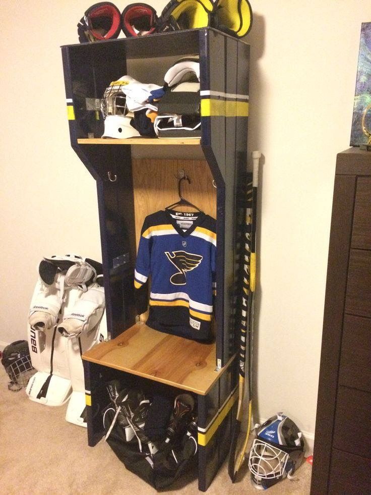 a hockey locker is shown in the corner of a room filled with sports gear and equipment