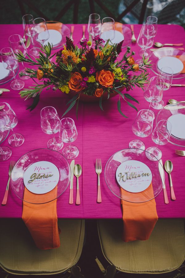 the table is set with place settings for dinner