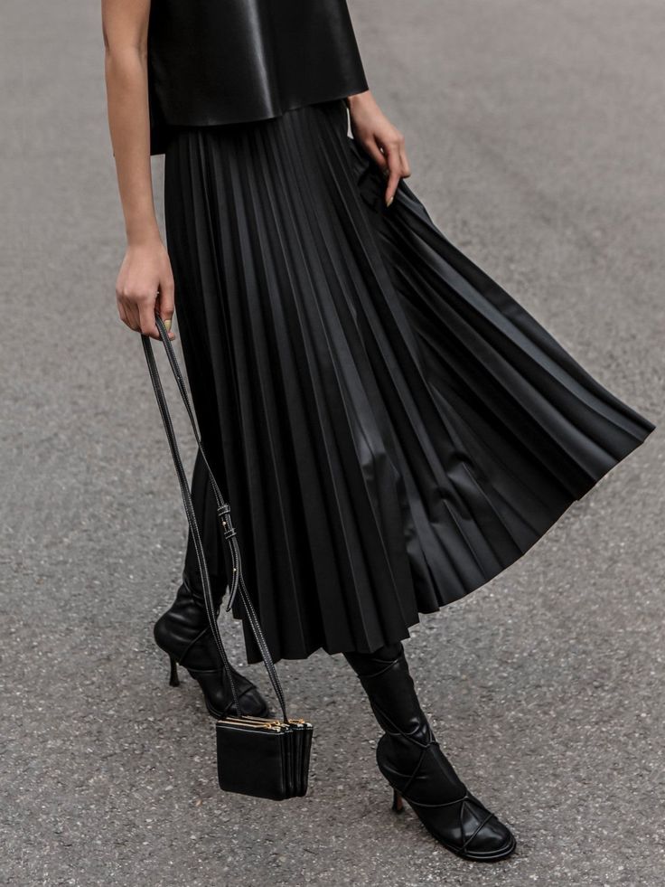 Vegan leather pleated skirt. Flared A Line. Model is in MINUSEY ONE SIZE. ✔️ Free worldwide express shipping over $100✔️ Loved by 6,500+ customers✔️ Limited edition collections, maximum style⠀⠀⠀⠀⠀⠀⠀⠀⠀Stay ahead of the trend with can’t-find-anywhere-else staples. Your closet will thank you 💕 * MINUSEY ONE SIZE = EU 34-38, US 2-6* 100% PU Leather* Dry clean* Made in Korea - Model Height: 172cm/5'7" (US2, EU34) Leather Skirt Mini Pleated, Luxury Brown Skirt With Belt Loops, Maxi Skirt With Boots Pleated, Luxury Brown Pleated Skirt, Luxury Chic Flared Draped Skirt, Luxury Pleated Flowy Mini Skirt, Luxury Asymmetrical Pleated Mini Skirt, Luxury Chic Draped Flared Skirt, Luxury Flowy Mini Pleated Skirt