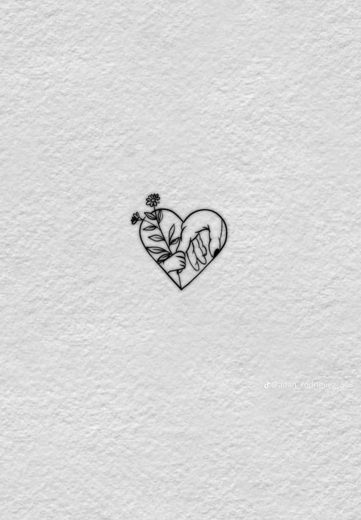 a drawing of a heart with flowers in the middle on a white paper wall background