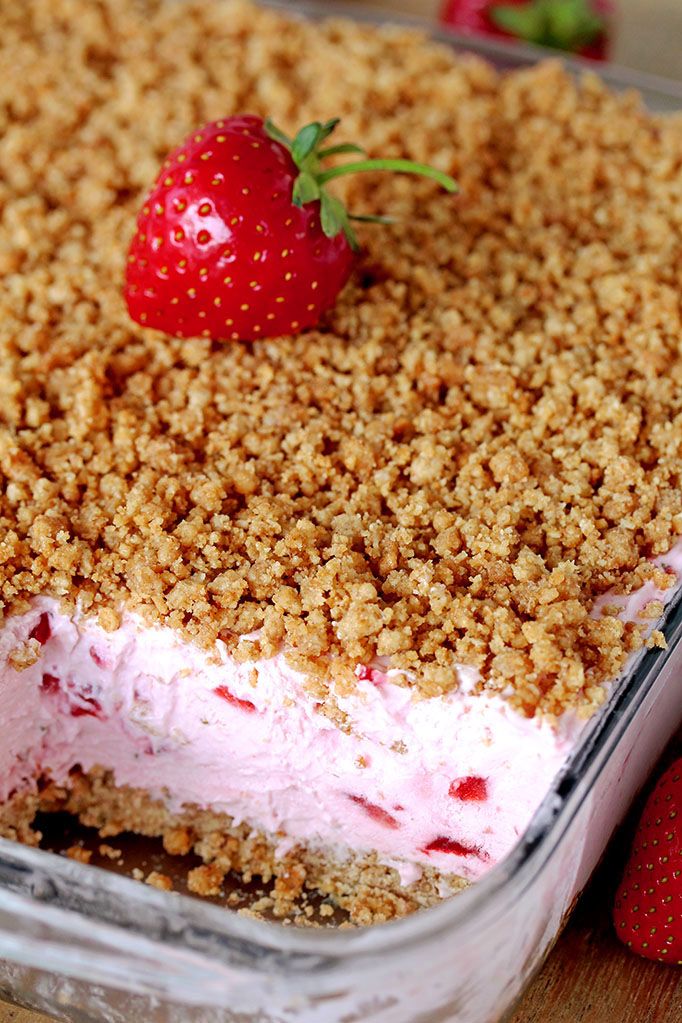 a close up of a dessert in a pan with strawberries