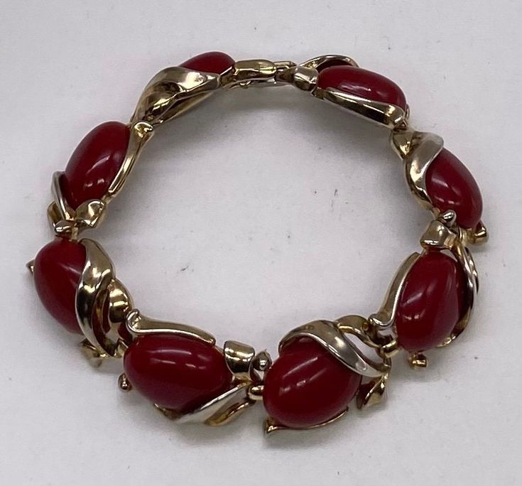 "Beautiful Art Deco Crown Trifari Gold Tone Red Lucite Links Bracelet pre/owned condition measures 7 1/4\" length by 5/8\" width." Red Costume Jewelry Bracelets As Gift, Vintage Adjustable Red Bracelets, Vintage Red Adjustable Bracelets, Vintage Red Adjustable Bracelet, Red Retro Bangle Jewelry, Vintage Red Bracelet As A Gift, Vintage Red Bracelet For Gifts, Adjustable Red Oval Bracelet, Adjustable Red Oval Bracelets