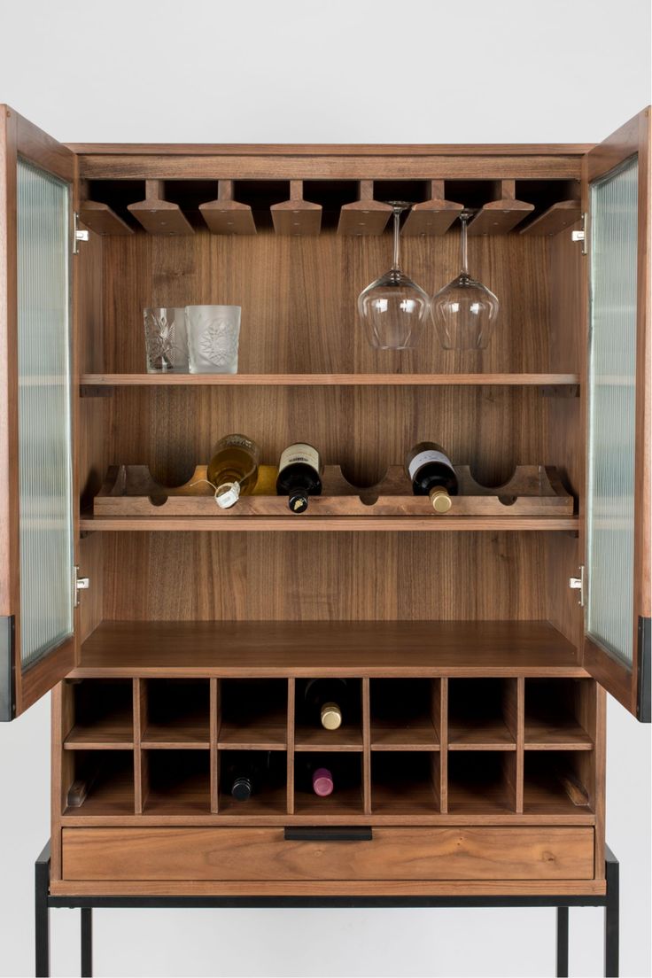 a wooden cabinet with wine glasses and bottles