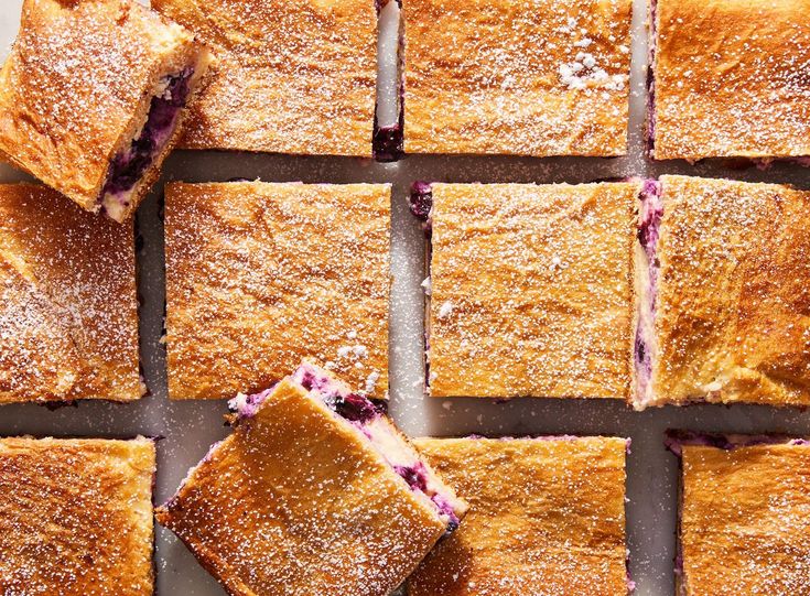 blueberry dessert squares cut into squares on a table