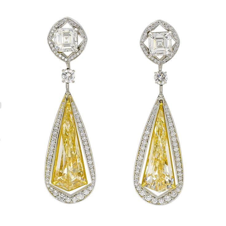 Unique certified fancy yellow diamond earrings. by NALLY Two kite shape fancy yellow diamonds with the total weight of 10.49 carats set in 18k yellow gold, accented with 160 brilliant shape diamond (0.83 carat) encrusted in white gold and suspended from a similiar style square shape diamonds (0.95 carat and 0.91 carat) that are connected with a single brilliant diamond with (0.24carat) the lower part. Total weight of the diamonds is:13.42 carat Yellow Diamond Earrings, Yellow Diamond Earring, Yellow Diamonds, Fancy Yellow Diamond, Jeweled Earrings, Mixed Metal Jewelry, Classic Earrings, Fan Earrings, Yellow Earrings