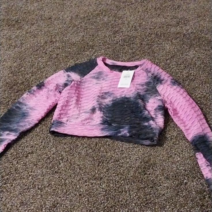 It Is Brand New Size L/Xl Pink And Black Scrunch Type Material And Tye Dye. I Paid 59.99 For It. It Still Has The Original Tags. Never Been Worn. Pink Stretch Long Sleeve Crop Top, Pink Long Sleeve Stretch Crop Top, Pink Long Sleeve Crop Top Casual Style, Pink Long Sleeve Casual Crop Top, Trendy Pink Crop Top For Workout, Pink Athleisure Crop Top For Spring, Trendy Pink Workout Crop Top, Pink Gym Tops For Spring, Pink Crop Top For Workout