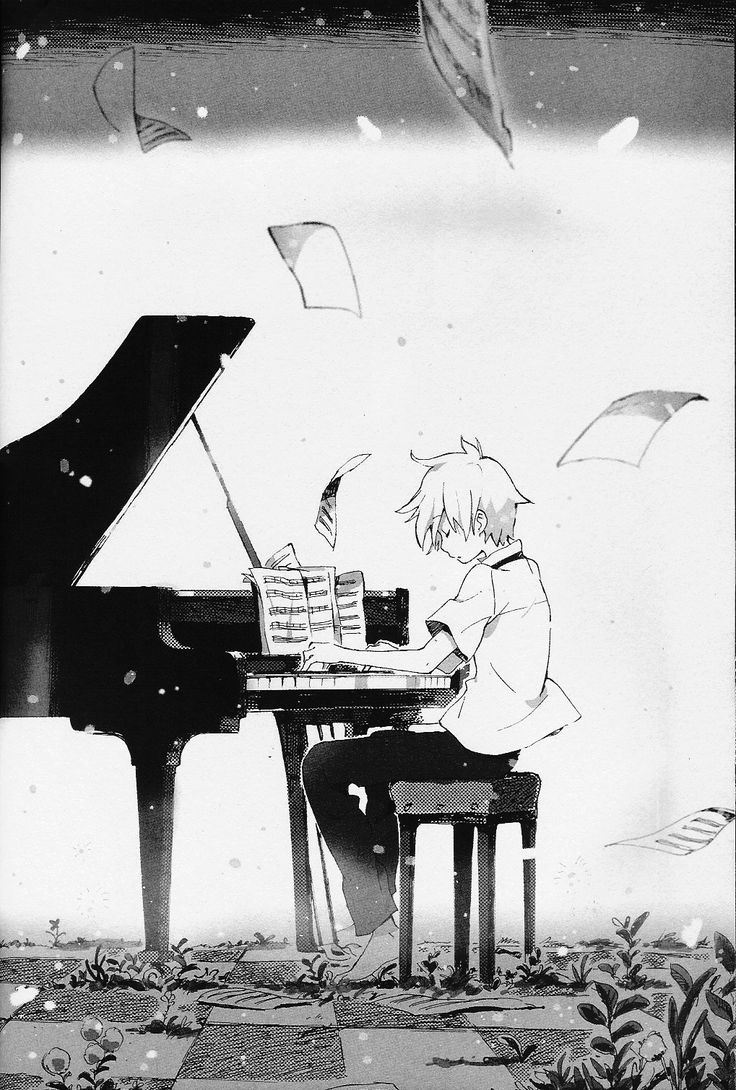 a person sitting at a piano with an umbrella