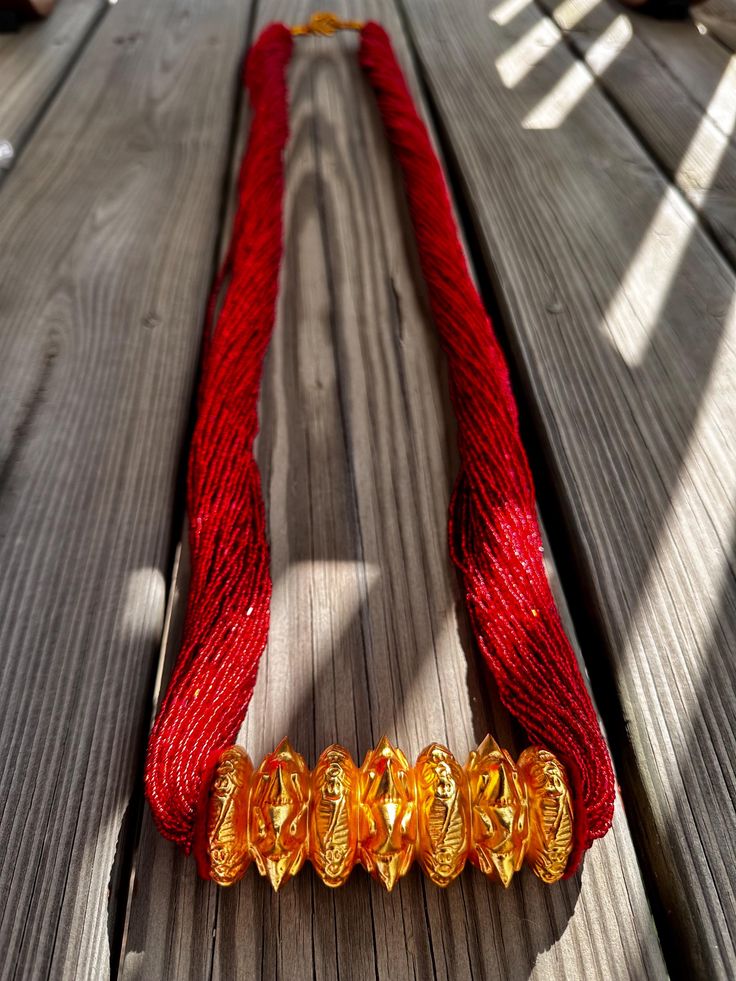 Nepali gold plated Chadke Tilhari. Chadke Tilhari is worn by Nepali married women's in any occasions or functions. Lightweight made of green and red pote goldplated jewelry Traditional Gold Jewelry For Puja, Traditional 22k Gold Red Jewelry, Ceremonial Temple Jewelry With Gold Beads, 22k Gold Beads Ceremonial Jewelry, Festive Gold Jewelry For Puja, Gold Plated Temple Necklace For Celebrations And Festivals, Ceremonial 22k Gold Necklaces With Zari Work, Traditional Jewelry With Zari Work For Celebrations, Traditional 22k Gold Temple Necklace For Celebration