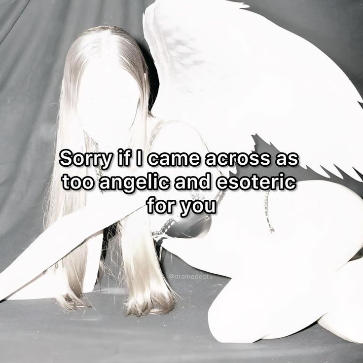 a woman with long white hair and angel wings on her back, sitting in front of a