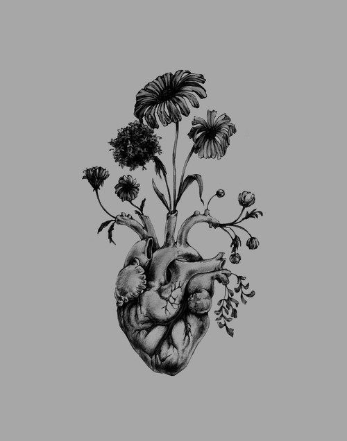 a black and white drawing of a human heart with flowers