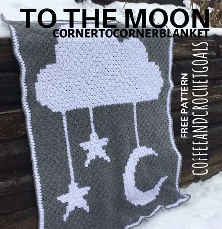 a crocheted blanket with the words to the moon on it