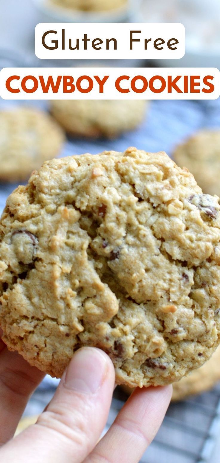 a hand holding a cookie with the words gluten free cowboy cookies