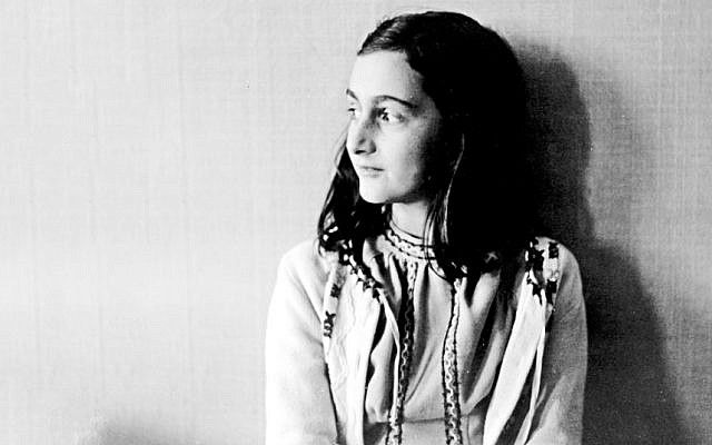 black and white photograph of a woman sitting on the floor