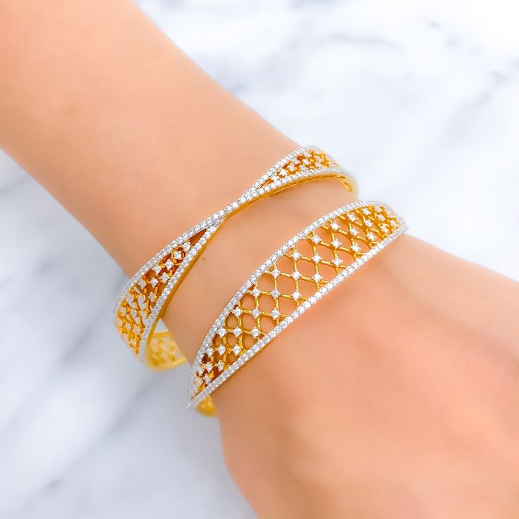 This exquisite set of 18k gold bangles, with a total weight of 32.4 grams, features a timeless tapered design adorned with dazzling diamonds. The yellow gold finish enhances their luxurious appeal, making them perfect for any special occasion. Each bangle is set with a total diamond weight of 6.51 carats, featuring F-G color and VS quality diamonds in round brilliant cut shapes. With a bangle size of 2.6 and an opening diameter of 2.35 inches, these pieces offer both elegance and comfort. Ideal Wedding Bangle In Yellow Gold With Brilliant Cut, Wedding Brilliant Cut Yellow Gold Bangle, Wedding Yellow Gold Bangle With Brilliant Cut, Formal Gold Bangle With Single Cut Diamonds, Elegant Gold Cuff Bracelet With Pave Setting, Gold Diamond Bangle Bracelet With Pavé Setting, Gold Bangle With Pave Setting As Gift, Elegant Gold Bangle With Brilliant Cut, Yellow Gold Wedding Bangle With Diamond Accents