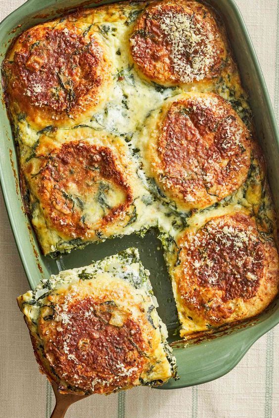 a casserole dish with spinach and cheese