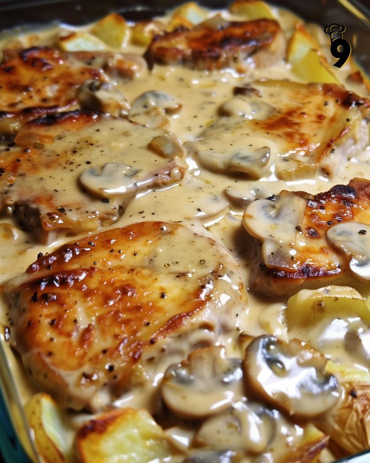 a casserole dish with chicken, potatoes and mushrooms covered in gravy